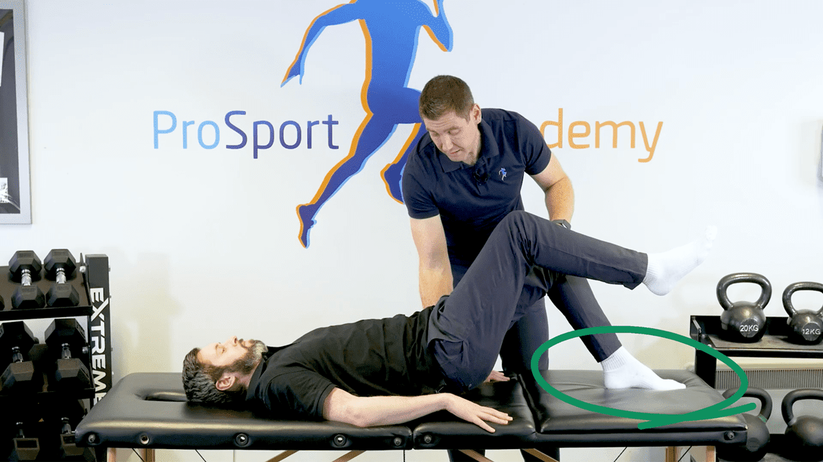 Keeping pressure through the midfoot in a single leg bridge isometric hamstring exercise
