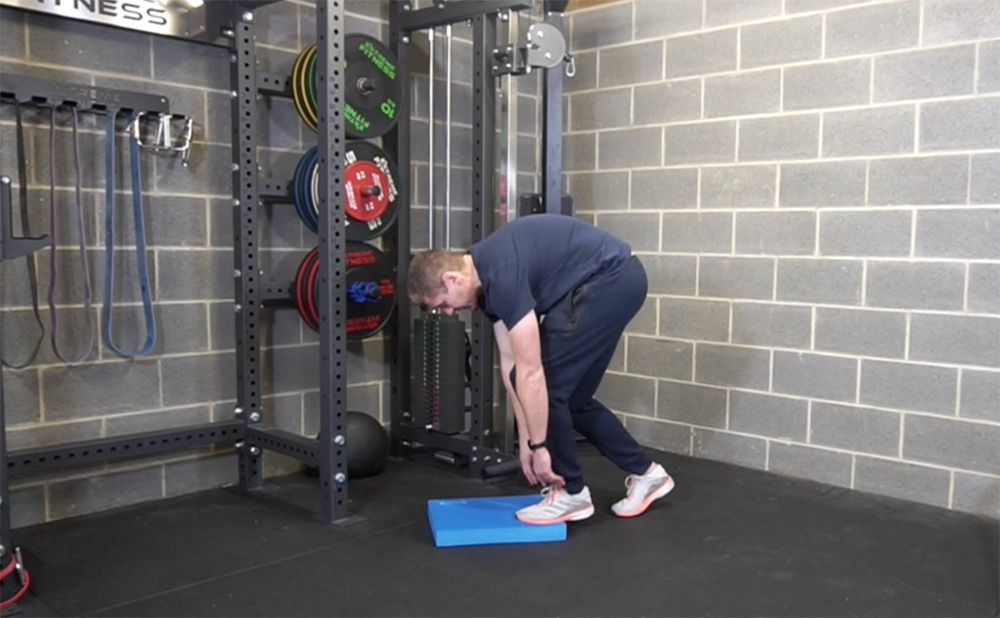 Using the slouch position to achieve thoracic flexion