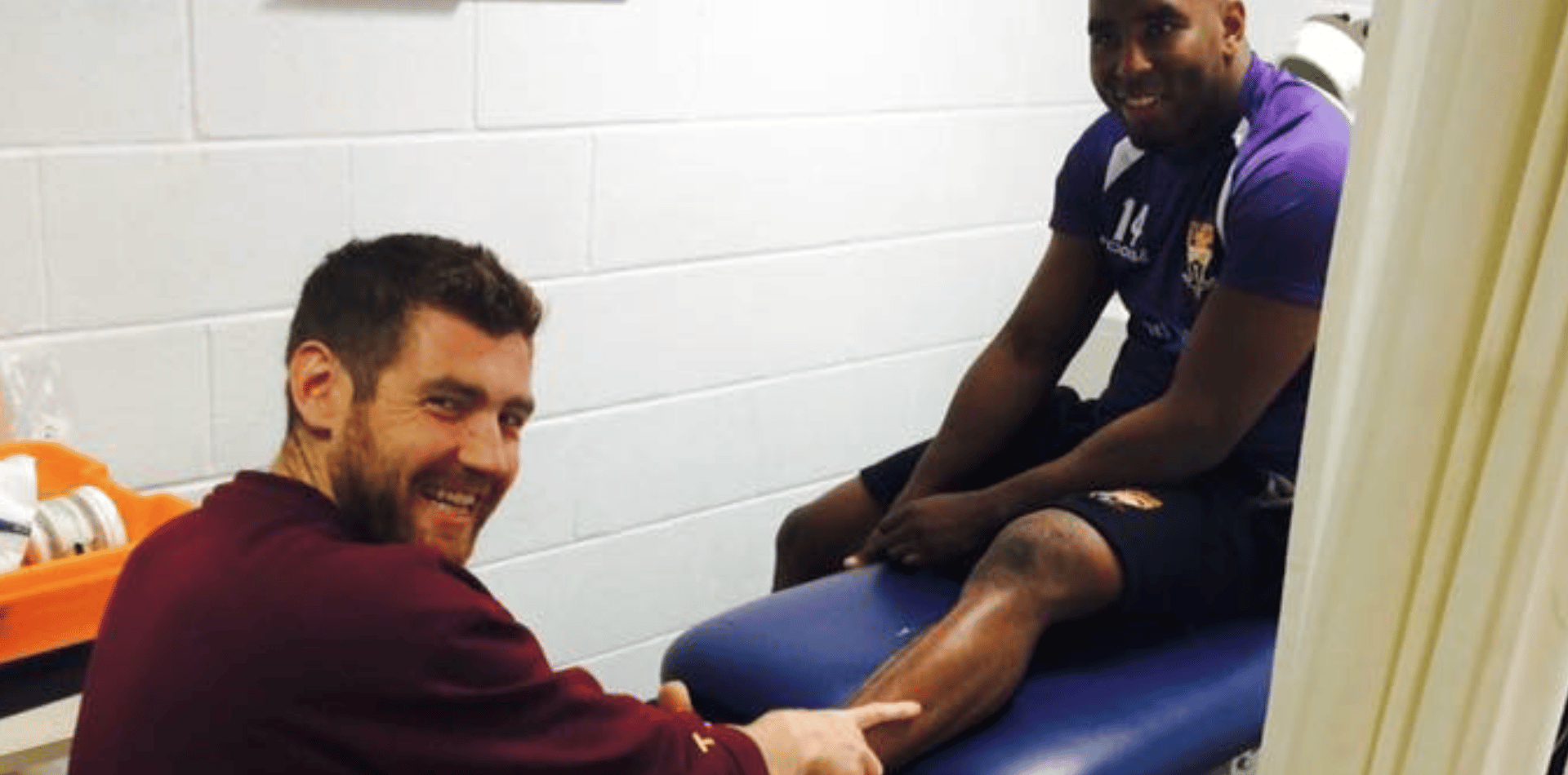 Dave O’Sullivan physiotherapist using hands-on treatment on pro sport patient at Huddersfield Giants Rugby League