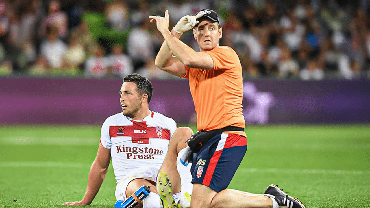 Dave O’Sullivan prosport physiotherapist on the field on the rugby world cup and an injured player